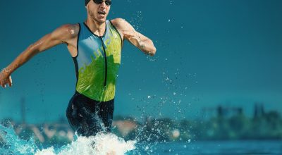 Professional triathlete swimming in river's open water