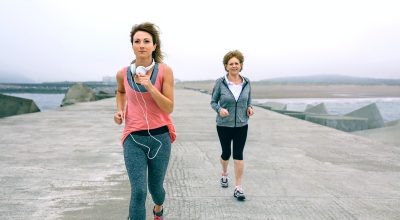 Senior and young sportswoman running