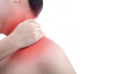 Young woman with neck pain and at white background